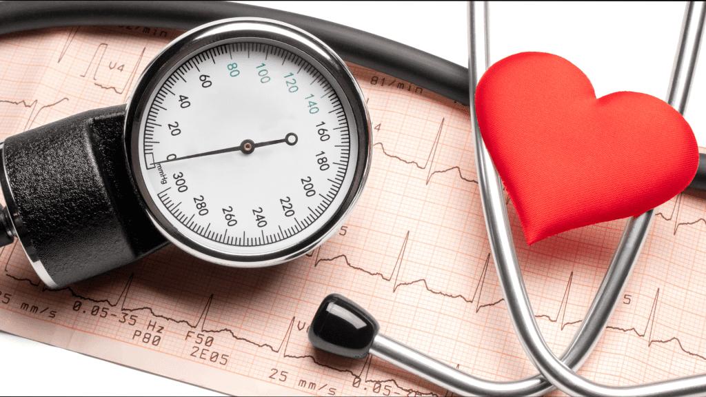 A blood pressure monitor, stethoscope, and heart-shaped figure over a printed ECF results report.